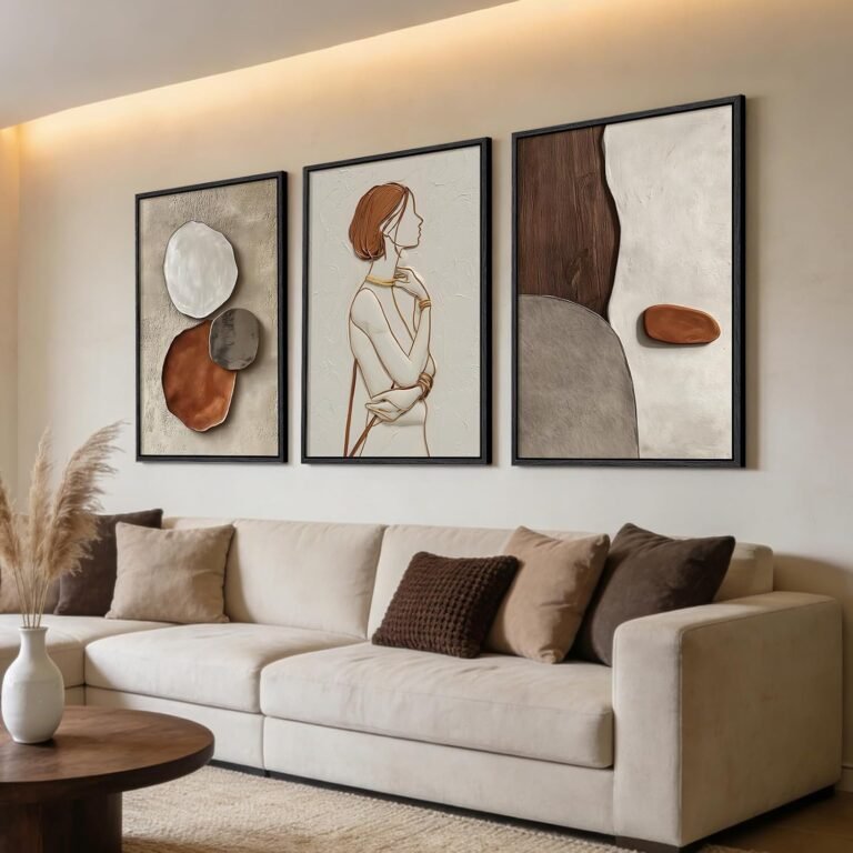 Three-piece framed wall art set above a living room sofa